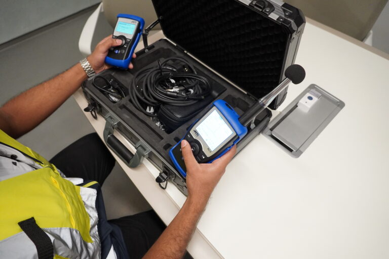 Acoustic engineer setting up devices for Acoustic testing