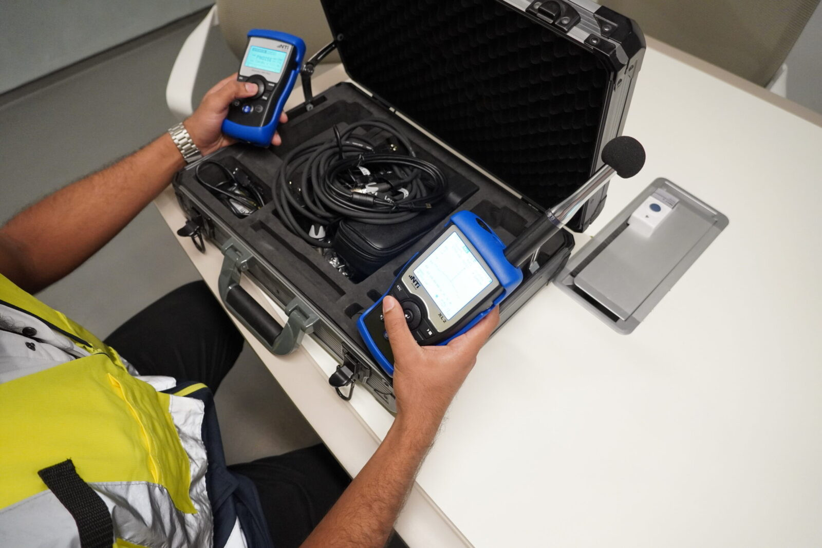 Acoustic engineer setting up devices for Acoustic testing